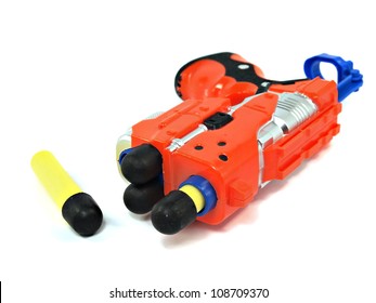 Orange Toy Dart Gun On A White Background