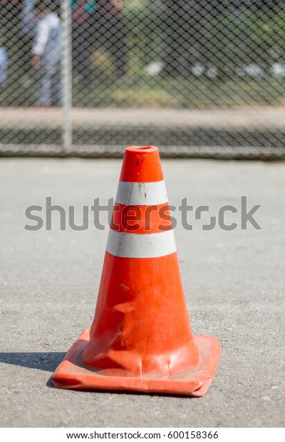 orange traffic cone on park\
