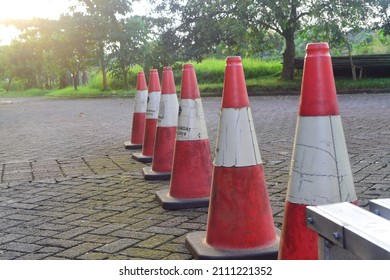 Orange Traffic Cone On The Side Of The Road. Useful For Signaling To Motorists.