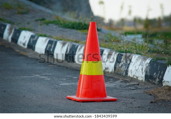 orange traffic cone for\
road divider