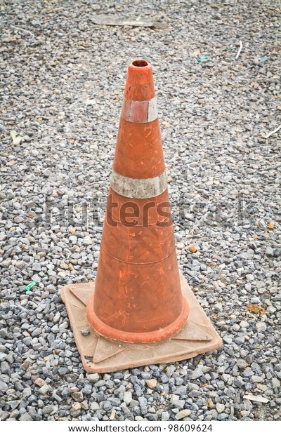 Orange traffic cones\
placed on the road