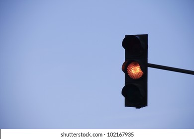 Orange Traffic Light In Front Of Blue Sky