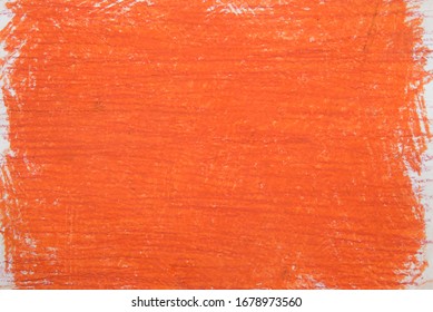 orange vax color  crayon on white paper background texture