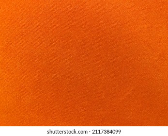Orange velvet fabric texture used as background. Empty Orange fabric background of soft and smooth textile material. There is space for text..	