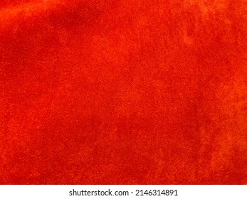 Orange velvet fabric texture used as background. Empty Orange fabric background of soft and smooth textile material. There is space for text.	