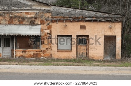 The orange wall of an abandoned shack in rural Texas 