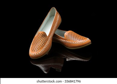 Orange Women Loafer Isolated On Black Background