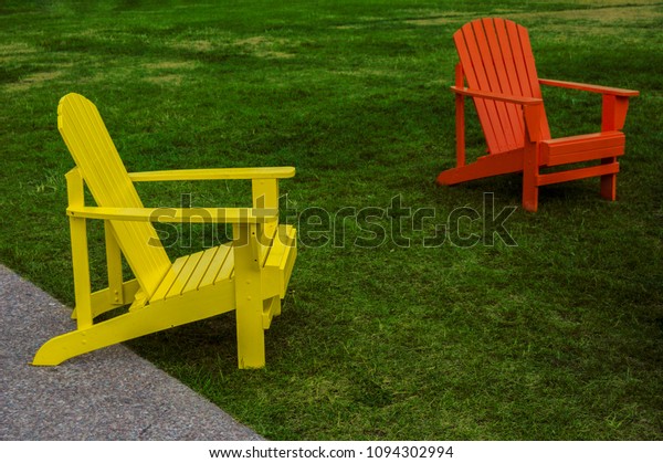 Orange Yellow Adirondack Chairs On Lawn Stock Photo Edit Now 1094302994