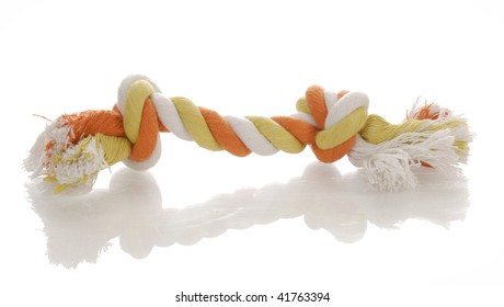 Orange And Yellow Dog Tug Rope Toy With Reflection On White Background