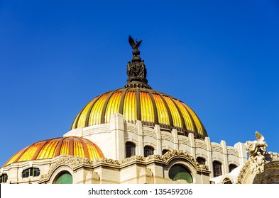The orange and yellow dome of the Palacio de las Bellas Artes in Mexico City