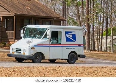  Orangeburg, SC/USA - February 12, 2018: US Postal Truck Delivering Mail In A Residential Subdivision.                              