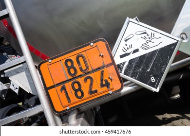 Orange-colored Plate With Hazard-identification Number 80 And UN-Number 1824 (sodium Hydroxide Solution)