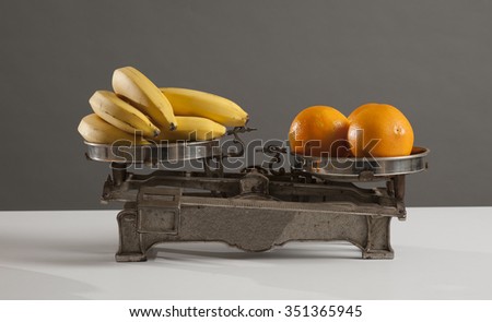 Oranges, and bananas on  old scale
