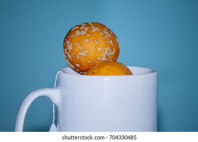 Oranges In Cup