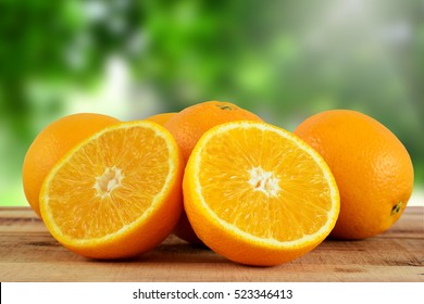 Oranges Fruit On Wooden Table.