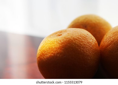 Oranges on a table.