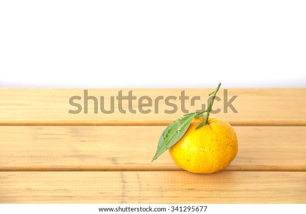 oranges on textured
weathered wooden table