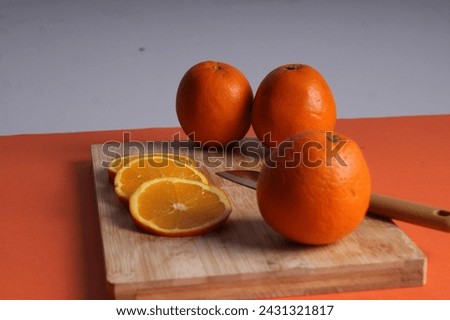 oranges on top of chopboard Stock photo © 