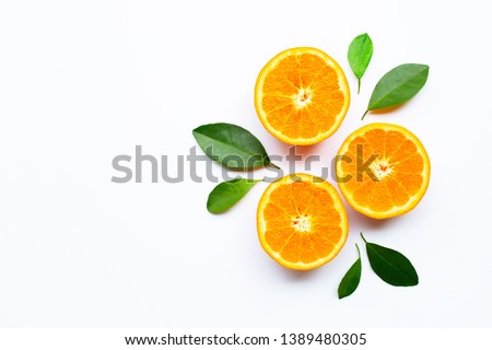 Oranges on white background. Copy space