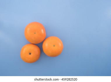Oranges over a blue background,flat lay