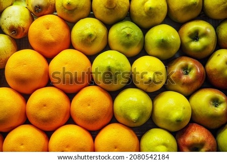 Oranges, pears, lemons and apples arranged nicely on street fruit market in Morocco