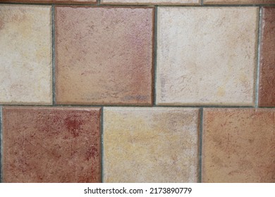 Orange-terracotta tiles on the wall. Brickwork. Backgrounds.  - Shutterstock ID 2173890779