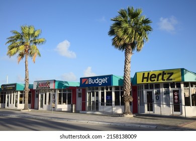 ORANJESTAD, ARUBA - DECEMBER 21, 2020: Car rental offices early in the morning outside the Queen Beatrix International Airport in Oranjestad on the Caribbean island of Aruba