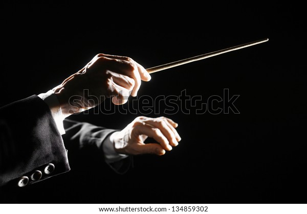 Orchestra conductor hands baton. Music director\
holding stick