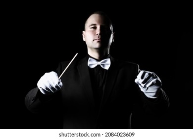 Orchestra Conductor Music Conducting Symphony. Maestro With Baton In White Gloves And Bowtie