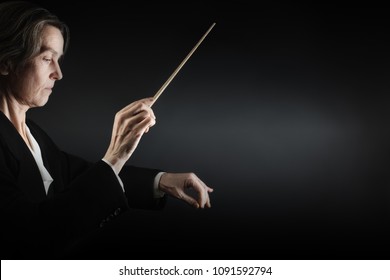 Orchestra Conductor Music Conducting. Woman Leader Maestro Hands With Baton