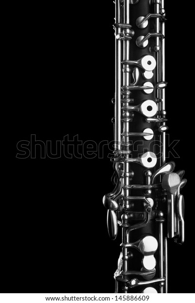 Orchestra musical instrument oboe. Woodwind\
classical music close up on\
black