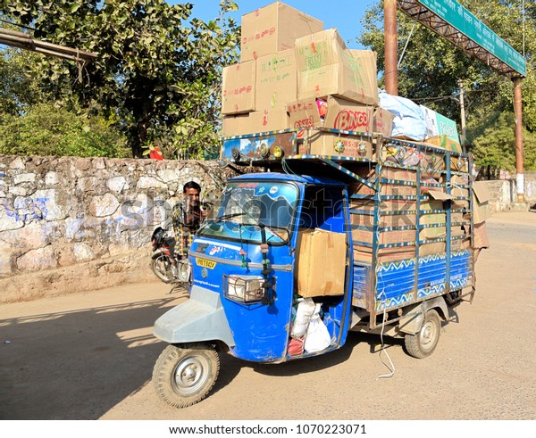 ORCHHA-February 14, 2017: Typically overloaded\
auto rickshaw (Tuk-Tuk). This type of taxi is popular type of\
transport among locals in\
India.