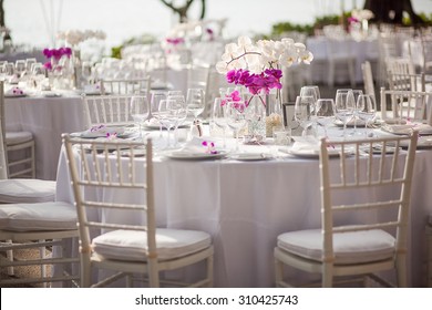 Orchid centerpiece at an outdoor event or wedding reception - Powered by Shutterstock