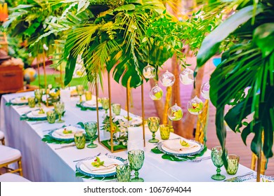 Orchids over a table in a restaurant at a tropical party