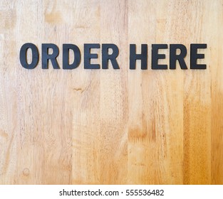 Order Here Sign On Wood Wall 