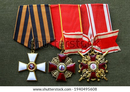 Order of the Russian officer.The Order of St. George 4 degrees at the St. George ribbon.Order of St. Anne.The Order of St. Stanislaus III degree with Swords on the tape.