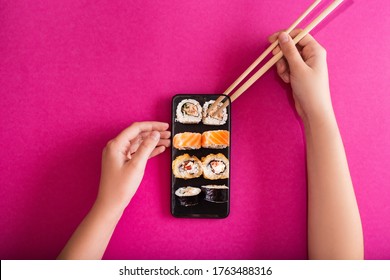 Order Sushi Set Using Mobile Phone App. Online Food Delivery Concept.