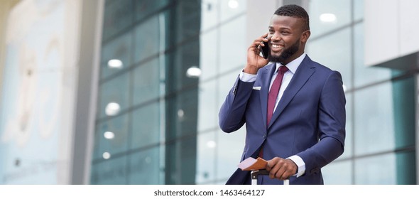 Order Taxi. African businessman arriving to airport and talking on phone. - Shutterstock ID 1463464127
