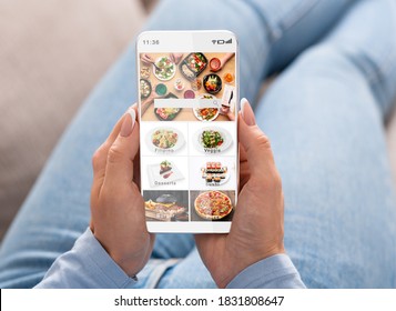 Ordering Food At Home Using Mobile Application During Pandemic Covid-19. Woman Surfing At Online Restaurant And Chooses Meal In Menu With Delivery, And Look At Screen, Pov, Close Up, Free Space