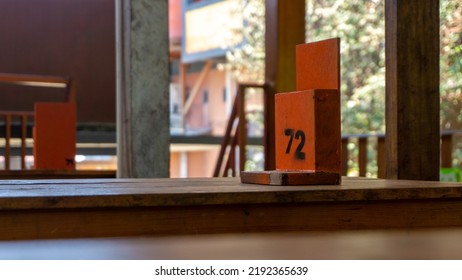 Ordering Number Sign On Table At Restaurant. Table Number Seventy Two. Awaiting On Number