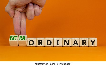 Ordinary or extraordinary symbol. Businessman turnes wooden cubes and changes words 'Ordinary extraordinary'. Beautiful orange background. Business, ordinary or extraordinary concept. Copy space. - Shutterstock ID 2140507031