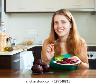 Ordinary Girl Eating Boiled Beets At Home Interior