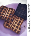 The ordinary white bread that was baked was square because it used a waffle mold. One of them was even black because it was burnt.
