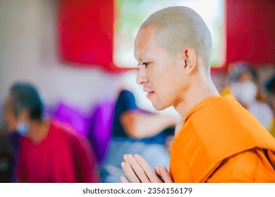 The ordination of the monks is a Thai culture where monks wear yellow, gold and white robes and shave their heads. Then procession around the temple to repay the kindness of father and mother. - Powered by Shutterstock