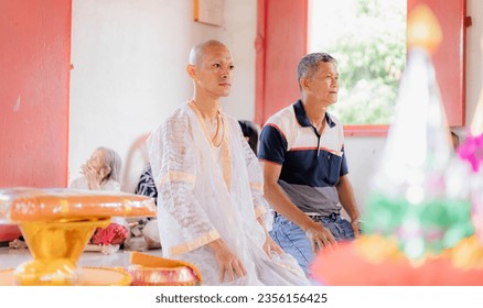 The ordination of the monks is a Thai culture where monks wear yellow, gold and white robes and shave their heads. Then procession around the temple to repay the kindness of father and mother. - Powered by Shutterstock