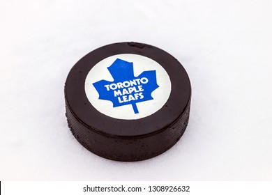 OREBRO, SWEDEN - FEBRUARY 3, 2019: Toronto Maple Leafs Logo On Ice Hockey Puck Outdoors In Snow