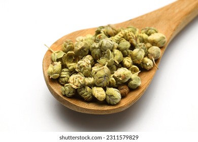 Oregano in the wooden spoon isolated on a white background. - Shutterstock ID 2311579829