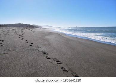 Oregon Beach. Foot Prints In The Sand. Long Sandy Beach. West Coast. Pacific North West. Blue Sky