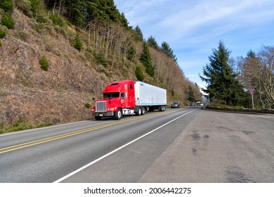 Oregon, USA - April 04, 2021: Big Freightliner Semi Truck For Transporting Riding On Highway Road