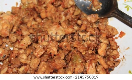 Orek Tempe or Cubed Tempeh Sauteeing , Indonesian Food, Cuisine Made from Cubed Tempeh with Spice, Chilli, and Sweet Soy Sauce. Cooking in the Kitchen, delicious food.